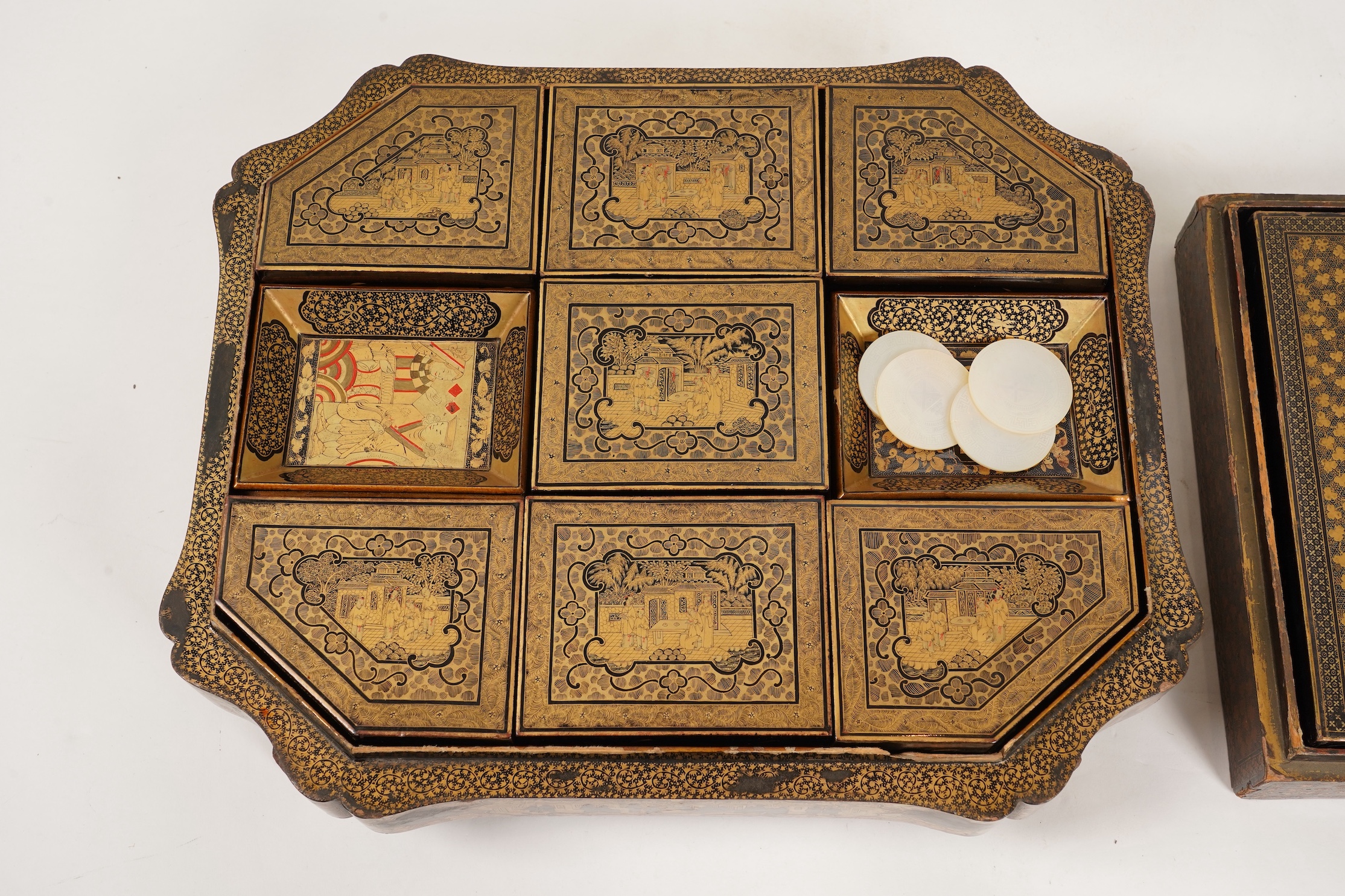 Two Chinese gilt decorated black lacquer games boxes, containing numerous mother-of-pearl counters, 19th century